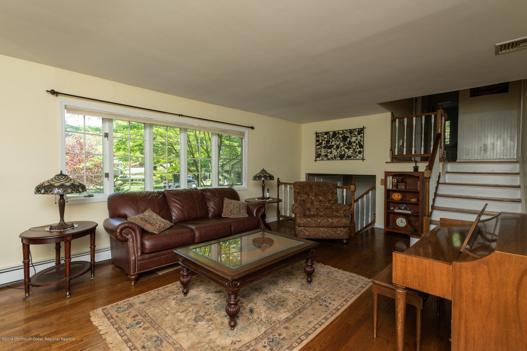 10 Gull Road Middletown, NJ 07748 - Photo 6 of 18 a living room with furniture and a large window