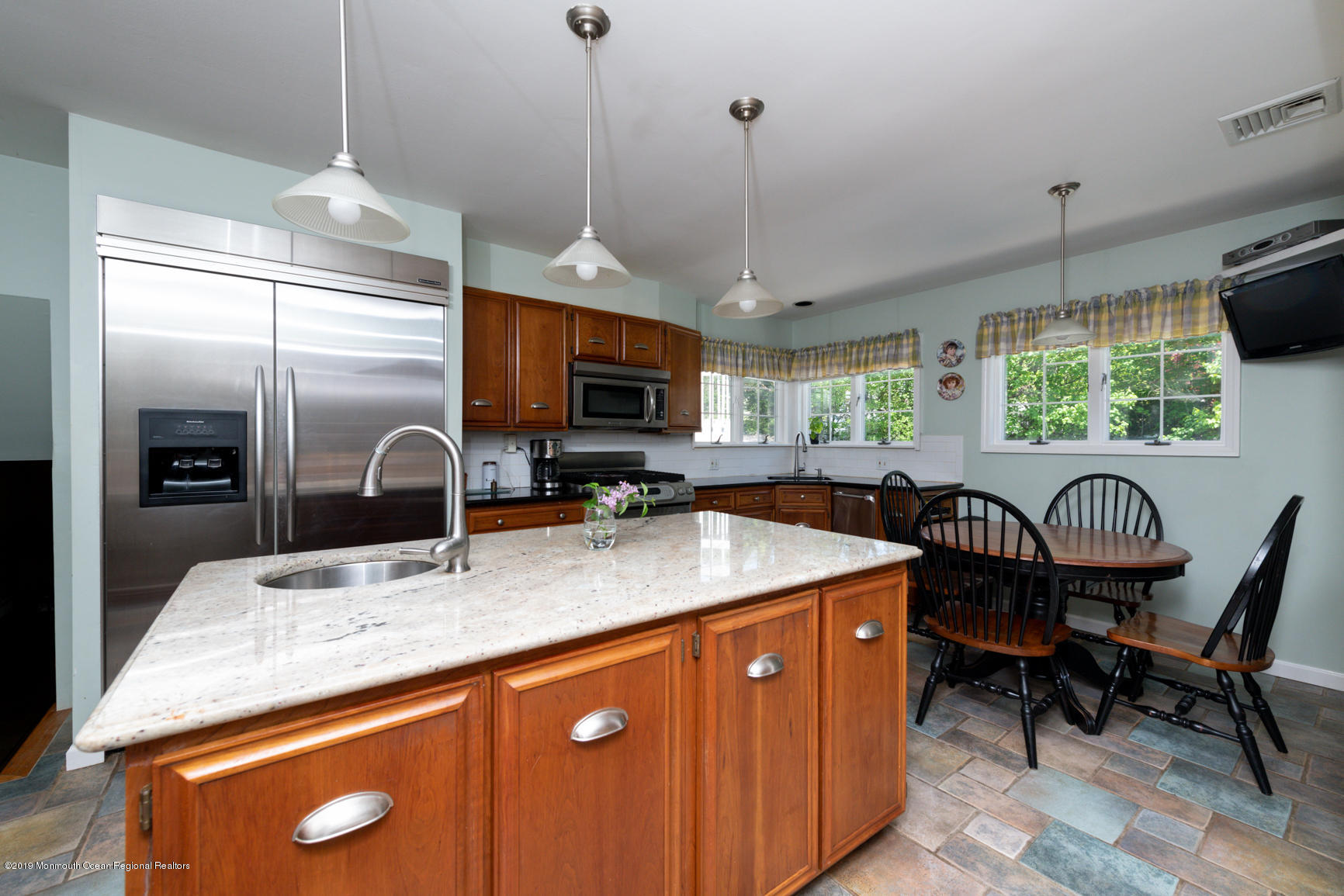 10 Gull Road Middletown, NJ 07748 - Photo 8 of 18 a kitchen with stainless steel appliances granite countertop a sink a stove and a refrigerator