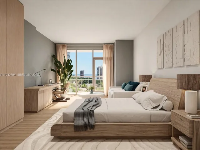 a living room with a large window and a wooden floor