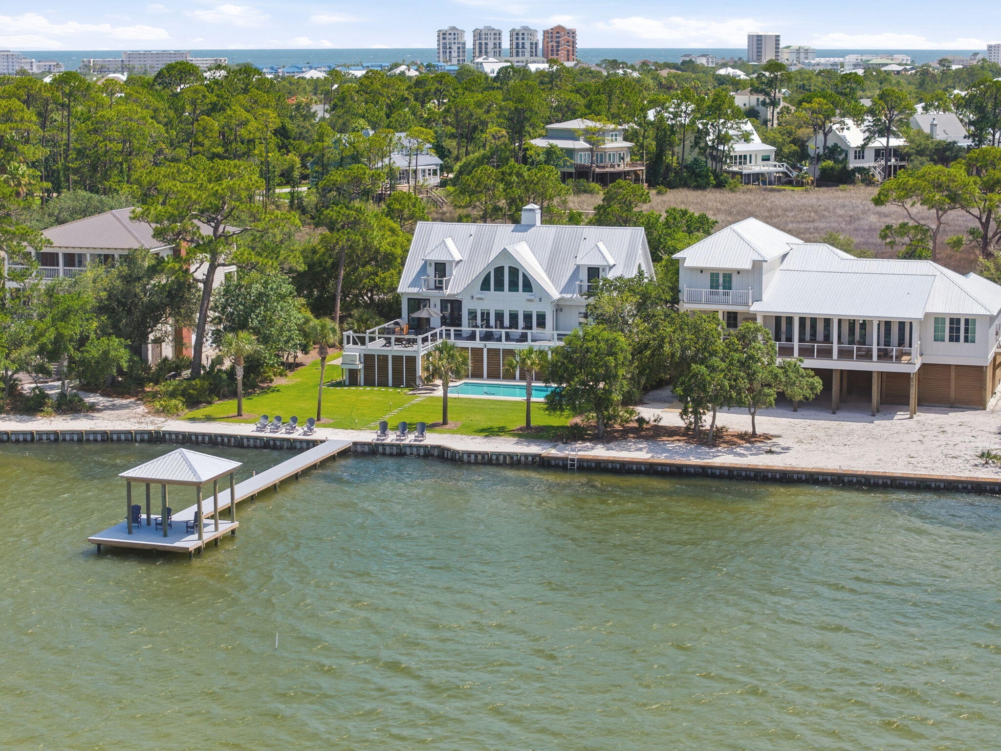 31061 Peninsula Drive Orange Beach, AL 36561 - Photo 76 of 93 an aerial view of a swimming pool with outdoor seating and yard