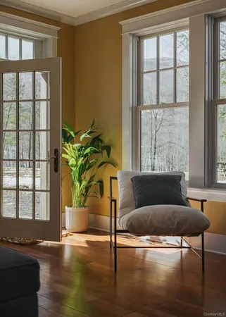 a living room with furniture and a window