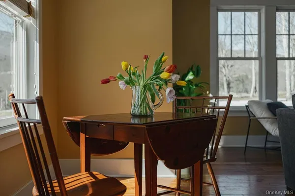 a view of a dining room with furniture and window