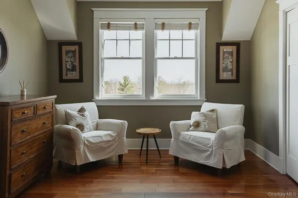 a living room with furniture and windows