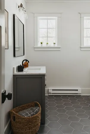 a room with a sink and cabinets