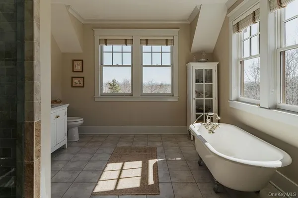 a bathroom with a bathtub sink and toilet