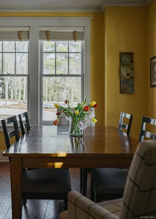 a view of a dining room with furniture and window