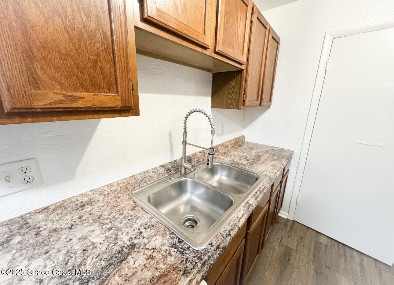 2130 Forest Knoll Drive Northeast, Unit 30208 Palm Bay, FL 32905 - Photo 16 of 19 a bathroom with a sink and a mirror