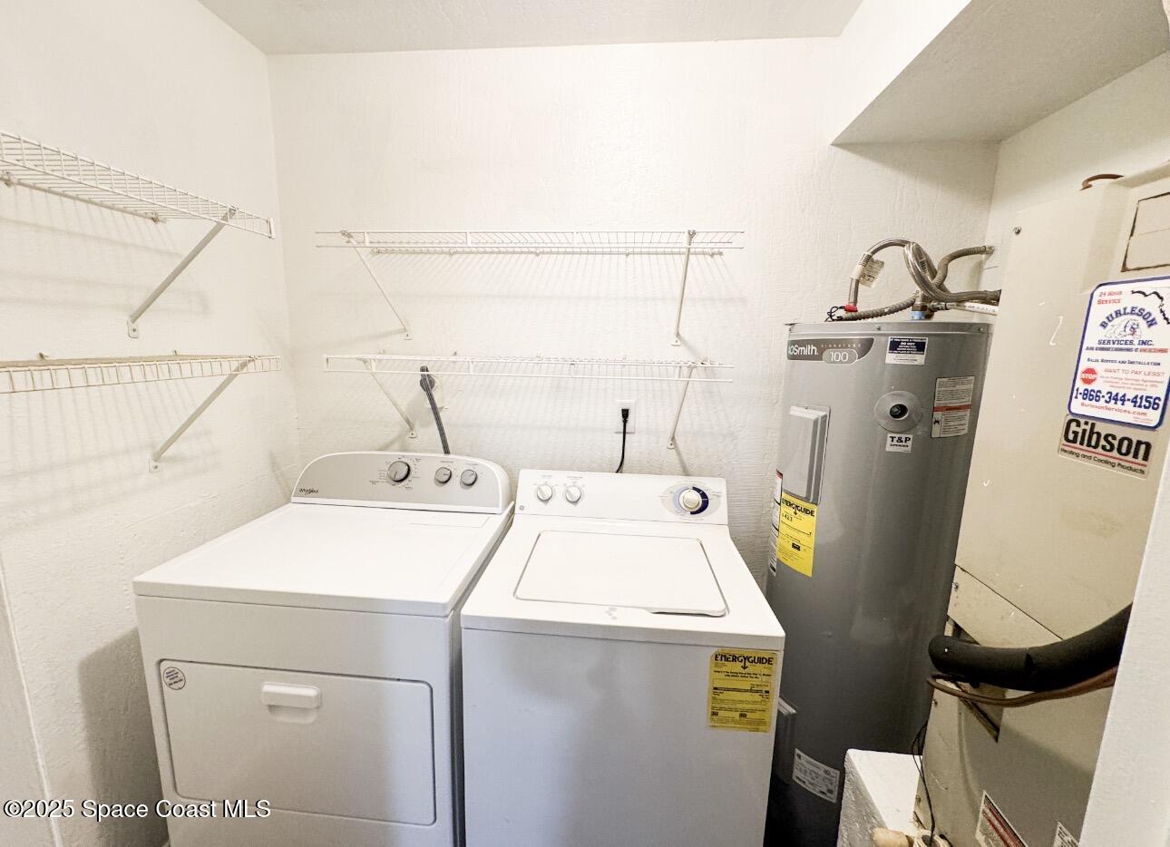 2130 Forest Knoll Drive Northeast, Unit 30208 Palm Bay, FL 32905 - Photo 17 of 19 a utility room with dryer and washer