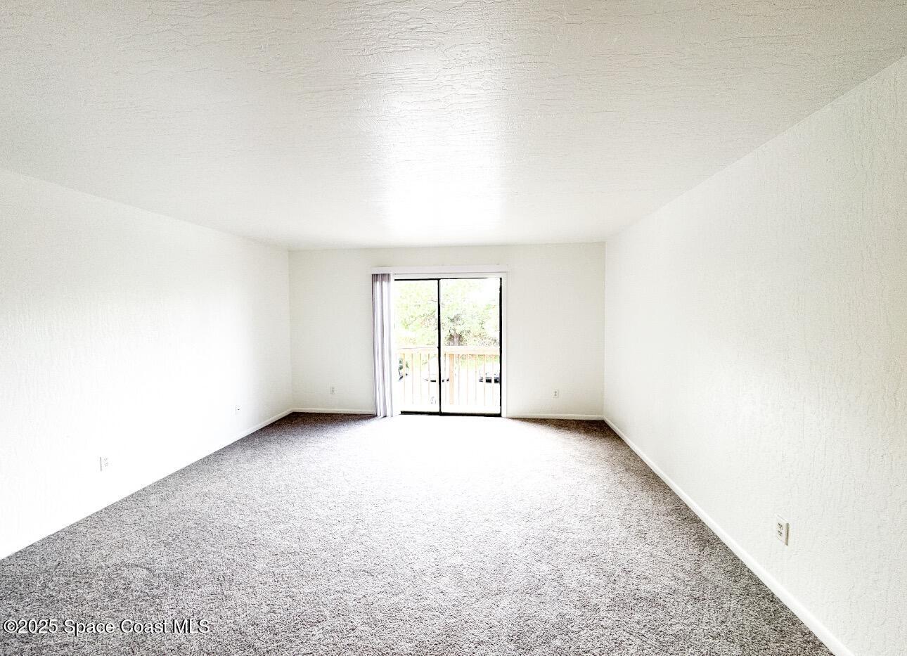 2130 Forest Knoll Drive Northeast, Unit 30208 Palm Bay, FL 32905 - Photo 5 of 19 an empty room with windows
