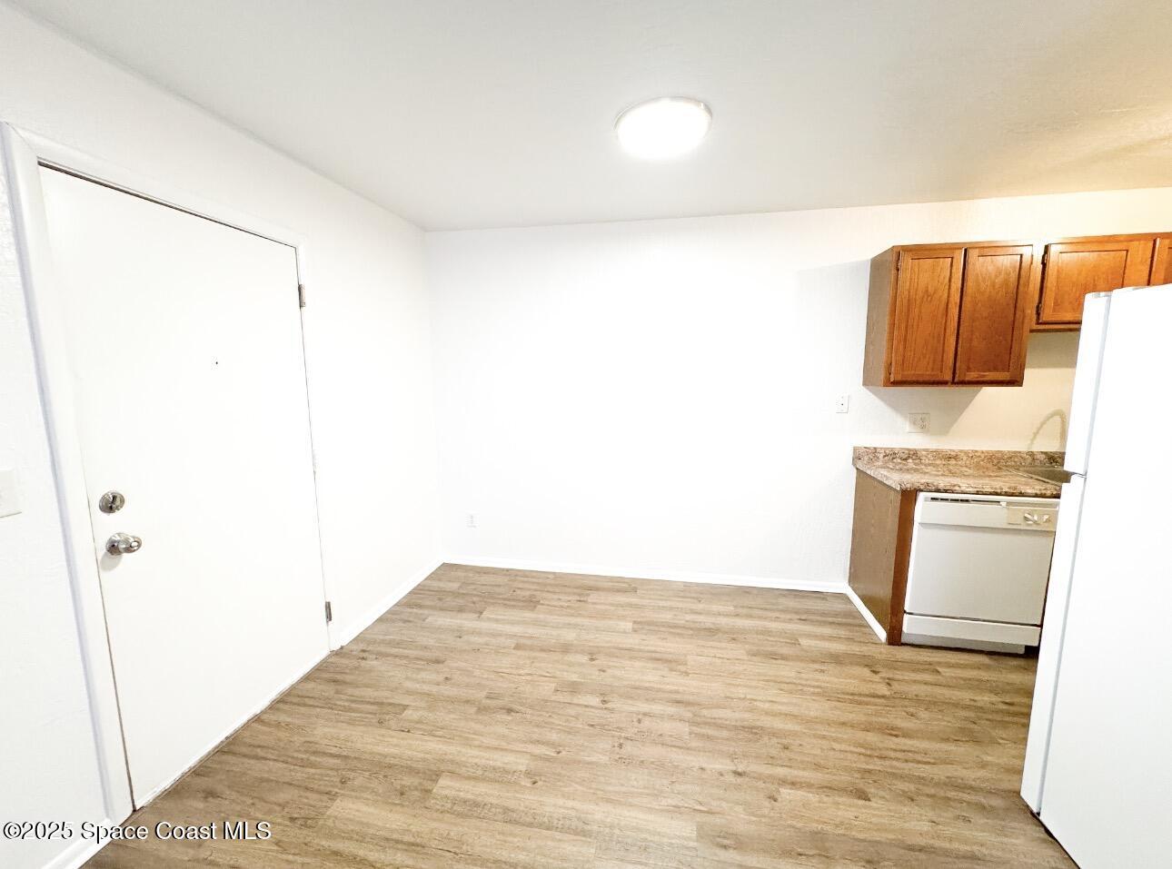 2130 Forest Knoll Drive Northeast, Unit 30208 Palm Bay, FL 32905 - Photo 6 of 19 a view of a room with wooden floor