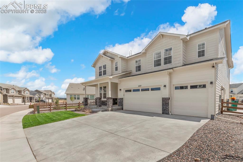 15777 Little Bluestem Road Monument, CO 80132 - Photo 44 of 50 a view of a white house with a yard