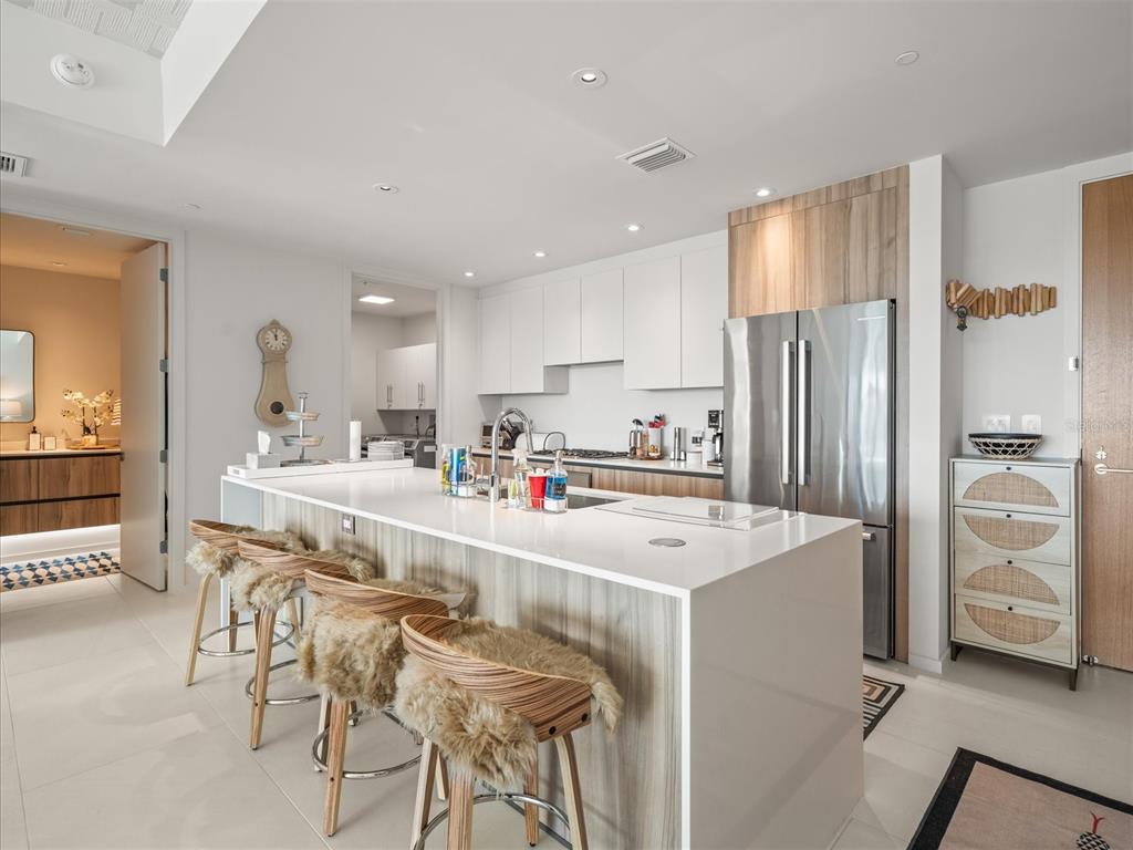 1020 Sunset Point Road, Unit 511 Clearwater, FL 33755 - Photo 17 of 93 a kitchen with stainless steel appliances a refrigerator and a stove