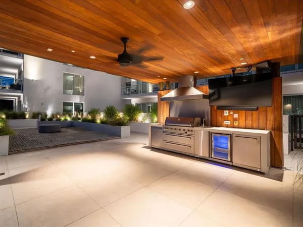 a view of a patio with couches chairs and a yard