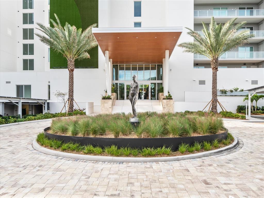 1020 Sunset Point Road, Unit 511 Clearwater, FL 33755 - Photo 27 of 93 a view of a house with a swimming pool and sitting area