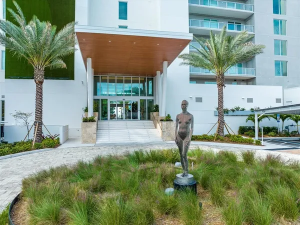a kitchen with stainless steel appliances a refrigerator sink and cabinets