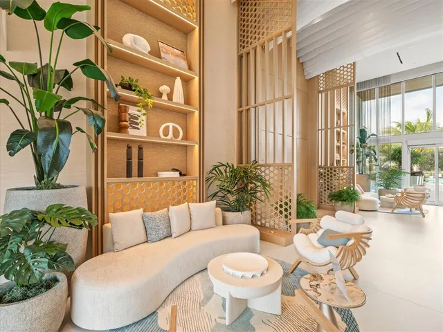 a kitchen with kitchen island granite countertop a table and chairs in it