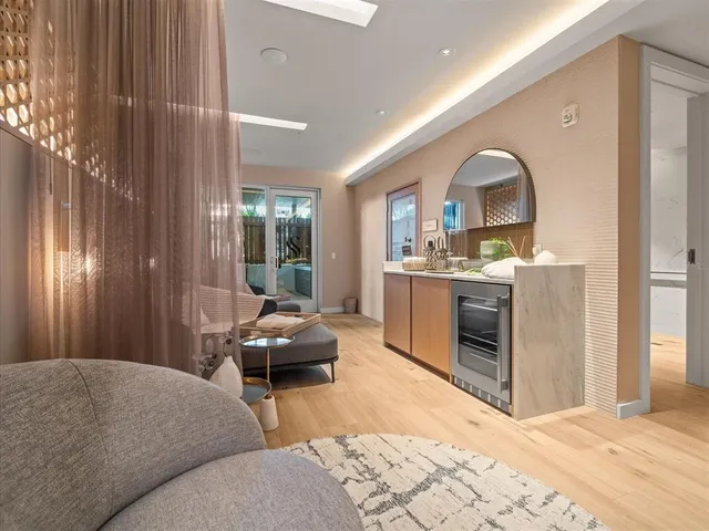 a living room filled with furniture and a potted plant