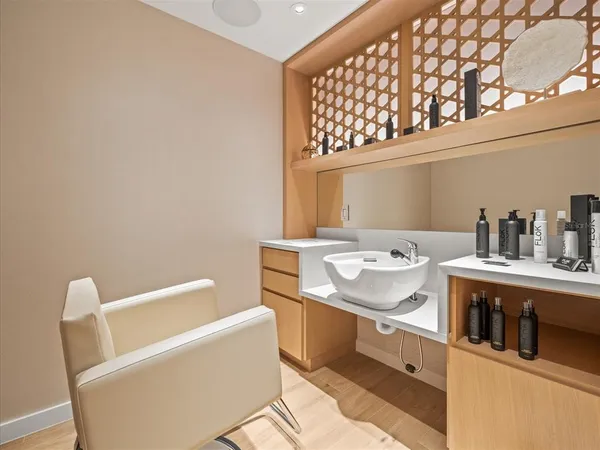 a living room with furniture a chandelier and a flat screen tv