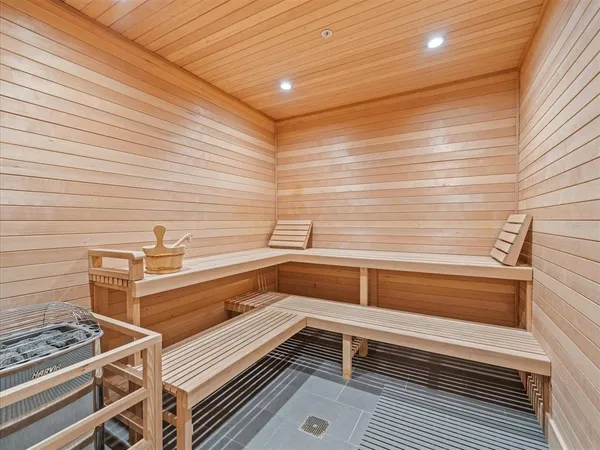 a living room filled with furniture and a flat screen tv