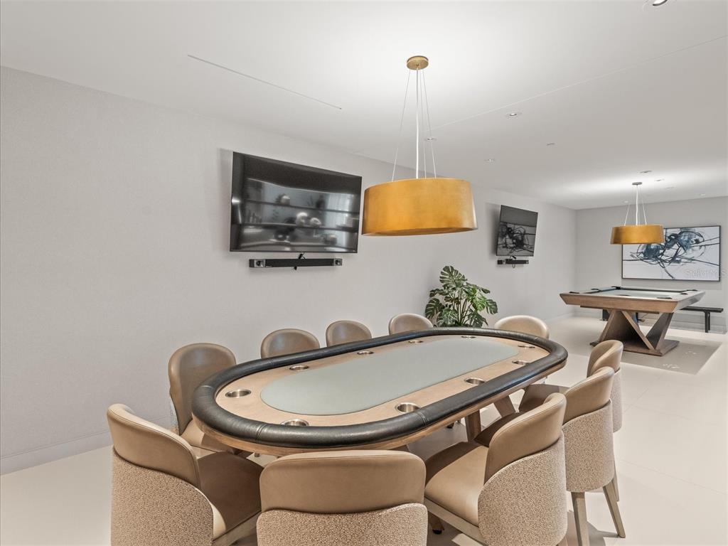 1020 Sunset Point Road, Unit 511 Clearwater, FL 33755 - Photo 46 of 93 a table and chairs in a room