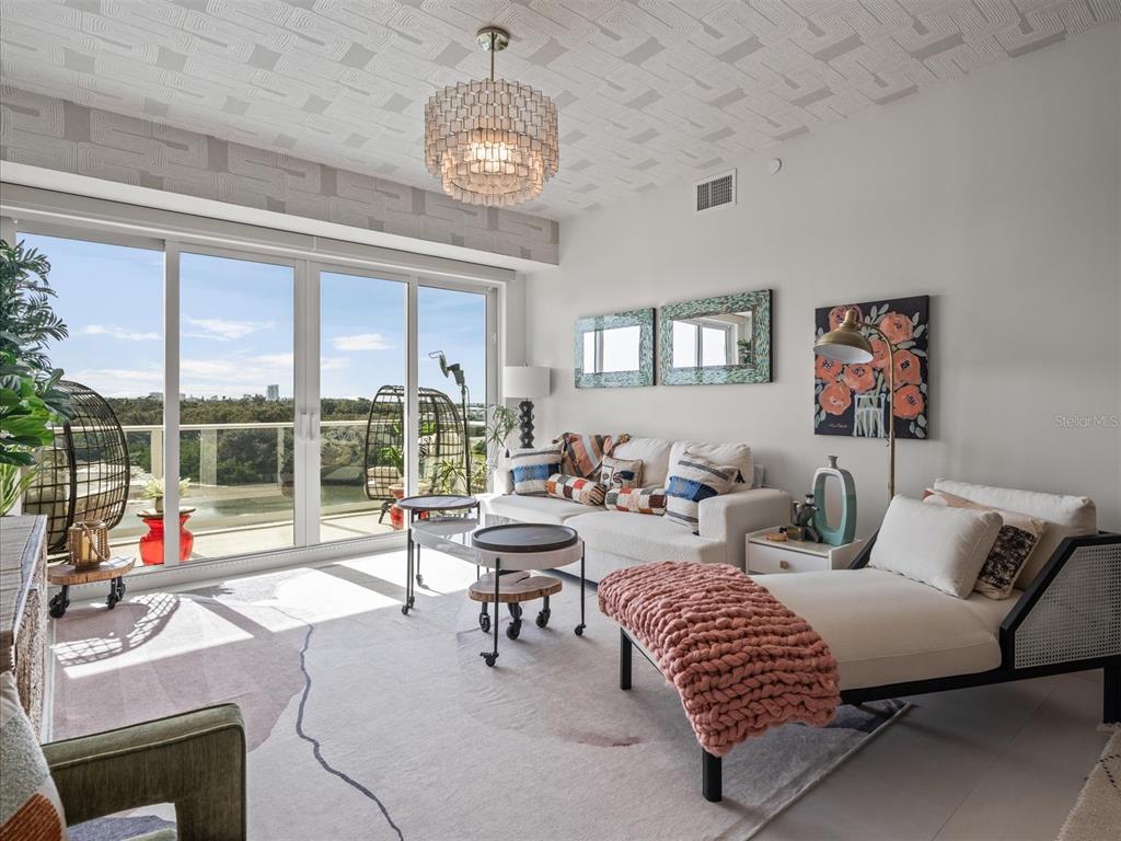 1020 Sunset Point Road, Unit 511 Clearwater, FL 33755 - Photo 72 of 93 a living room with furniture and a large window