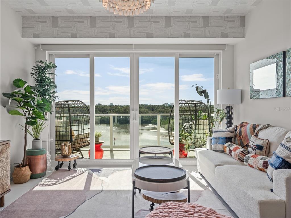 1020 Sunset Point Road, Unit 511 Clearwater, FL 33755 - Photo 74 of 93 a living room filled with furniture and a potted plant