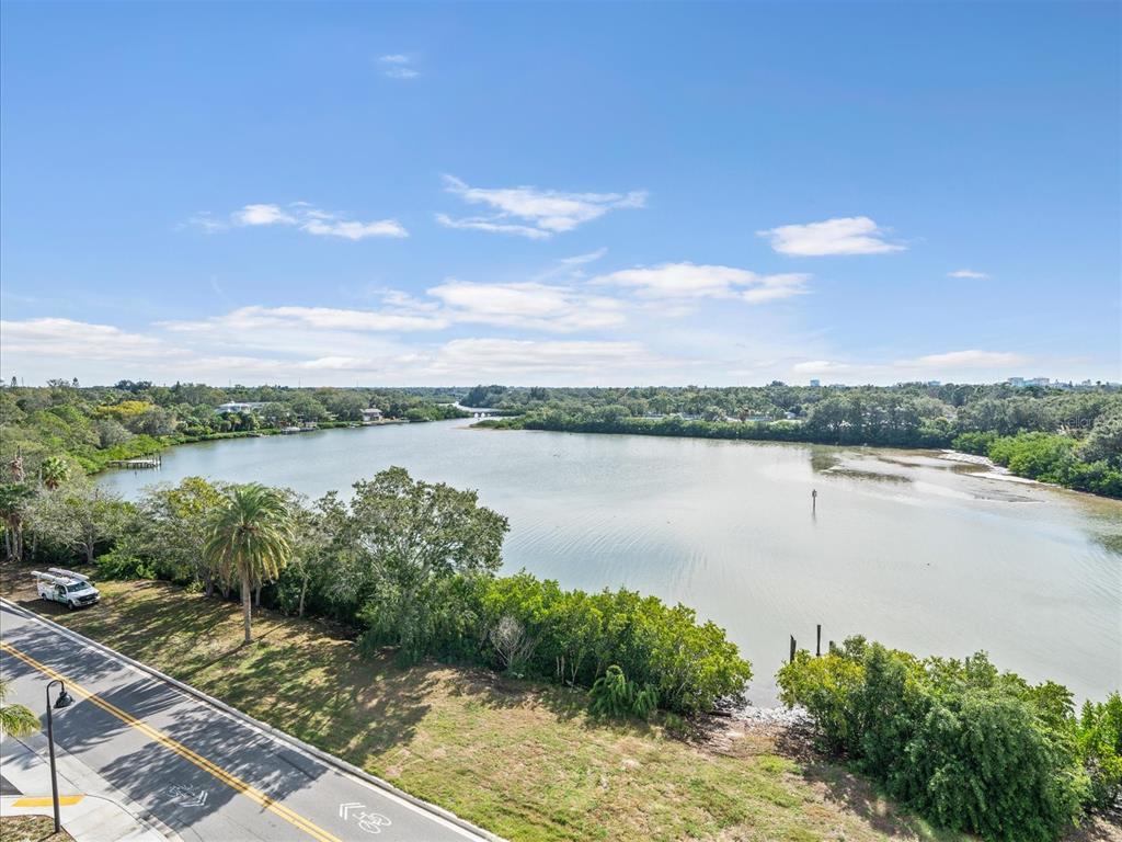 1020 Sunset Point Road, Unit 511 Clearwater, FL 33755 - Photo 80 of 93 a view of a lake with houses in the back