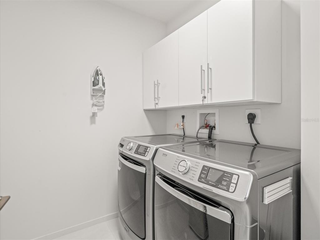 1020 Sunset Point Road, Unit 511 Clearwater, FL 33755 - Photo 93 of 93 a utility room with dryer and washer