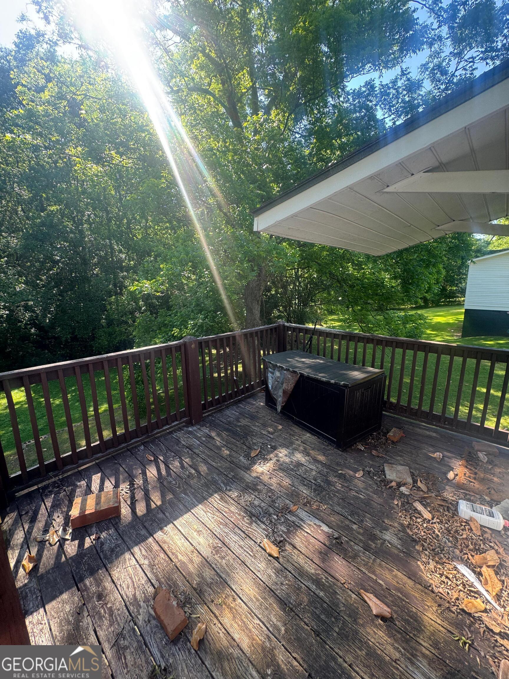 609 West Main Street Thomaston, GA 30286 - Photo 6 of 27 a view of deck with wooden floor and outdoor seating