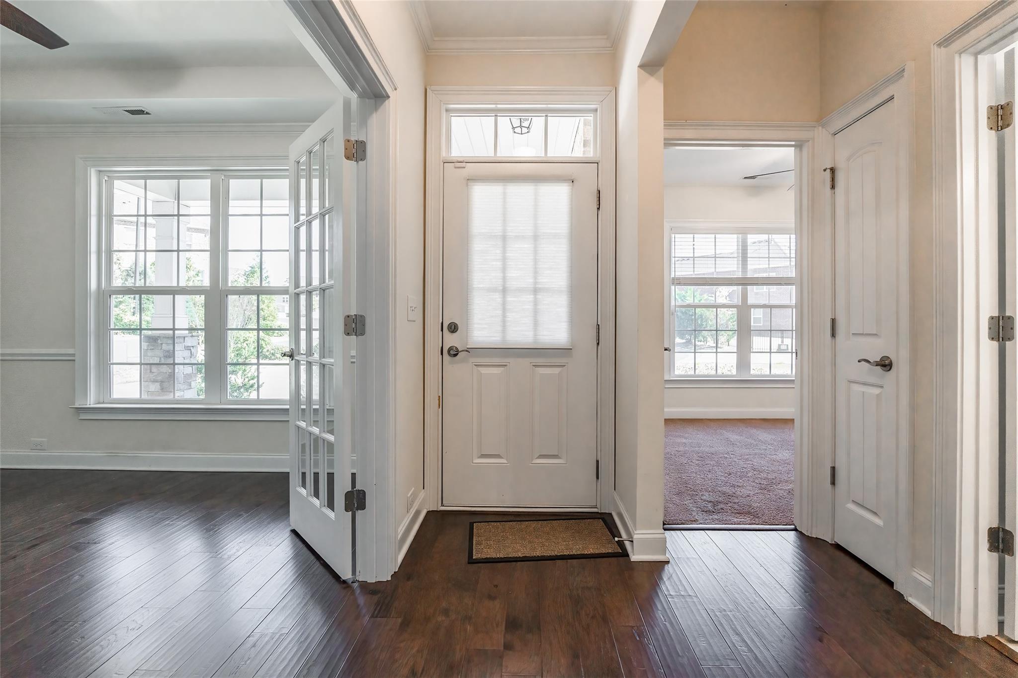 320 Skylar Court Fort Mill, SC 29708 - Photo 3 of 25 an empty room with wooden floor and windows
