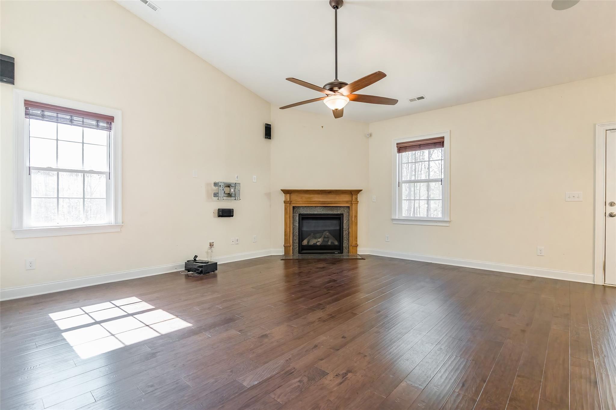 320 Skylar Court Fort Mill, SC 29708 - Photo 4 of 25 a view of empty room with wooden floor and fan