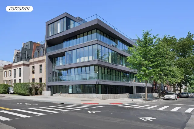a view of a building with a street