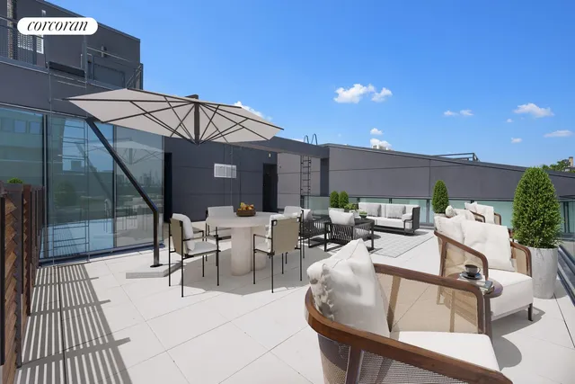 a view of a patio with couches table and chairs