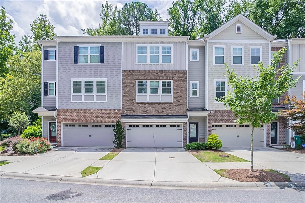 2819 White Oak Lane Decatur, GA 30032 - Photo 1 of 1 a front view of a house with a yard and garage
