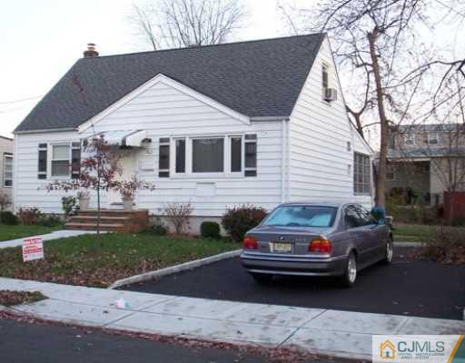 162 Midfield Road Colonia, NJ 07067 - Photo 2 of 2 a car parked in front of a house