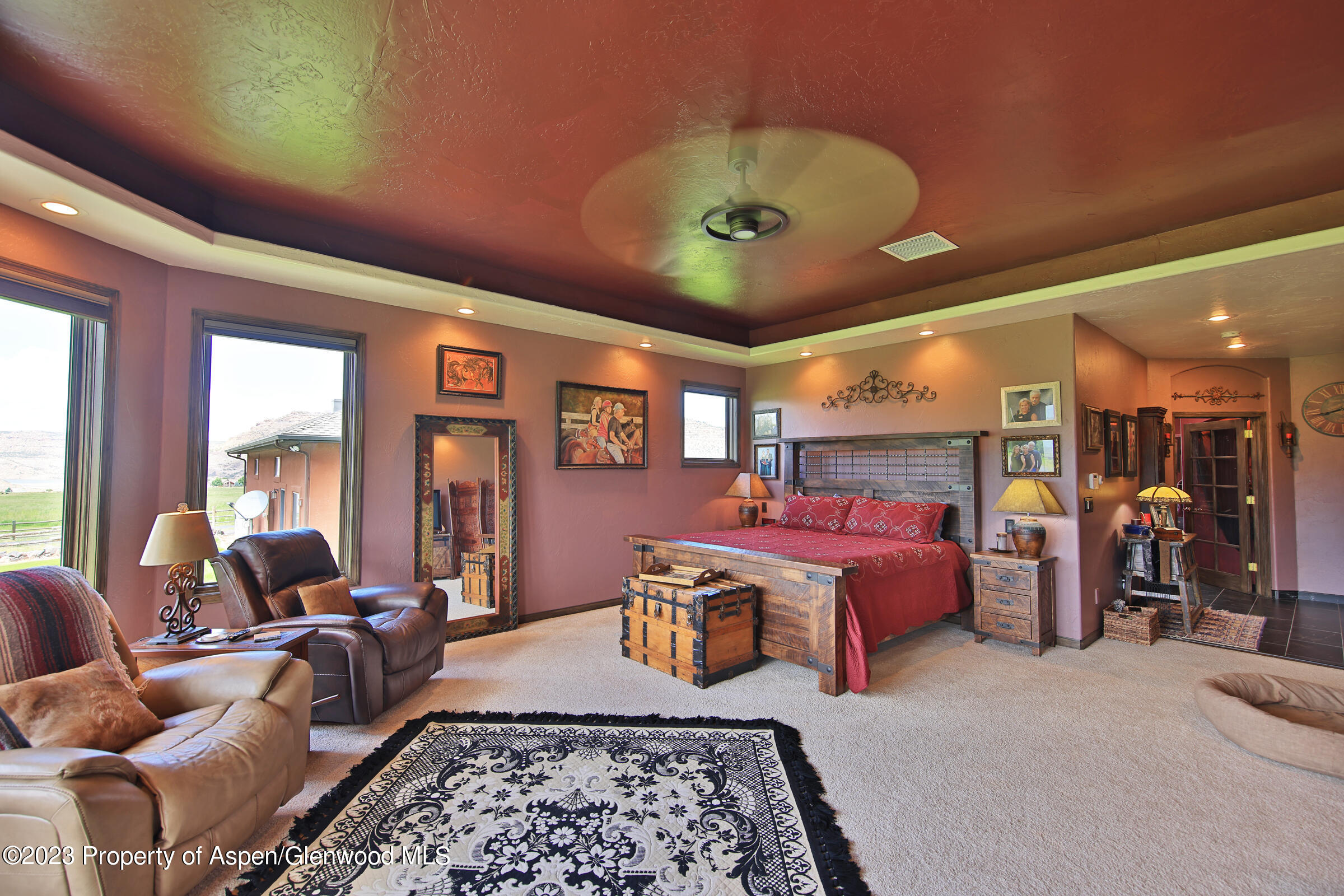 52962 KE Road Molina, CO 81646 - Photo 15 of 46 a bed room with furniture and a chandelier