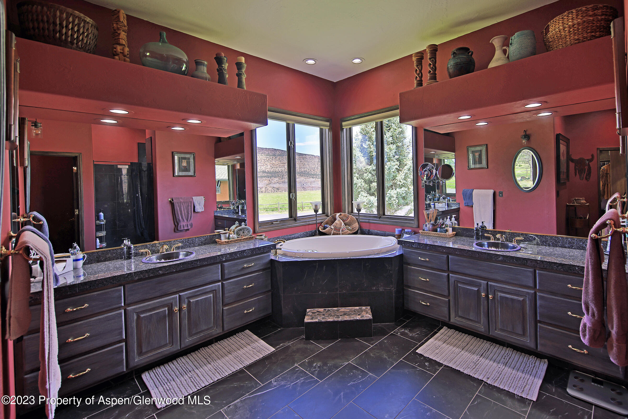 52962 KE Road Molina, CO 81646 - Photo 18 of 46 a large bathroom with a sink vanity and a mirror