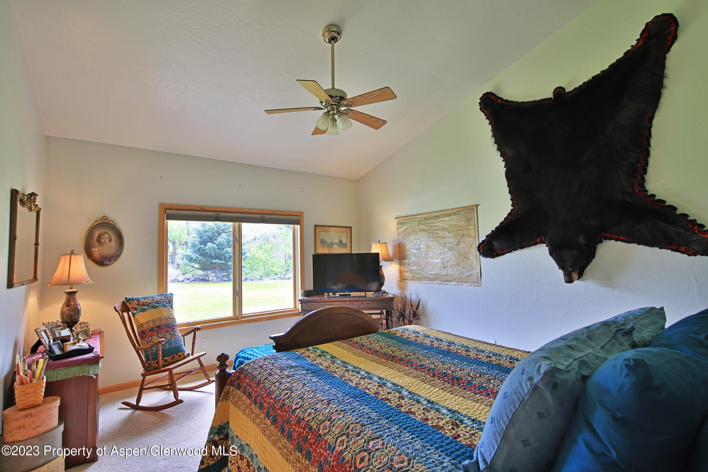 52962 KE Road Molina, CO 81646 - Photo 21 of 46 a bedroom with a bed and wooden floor