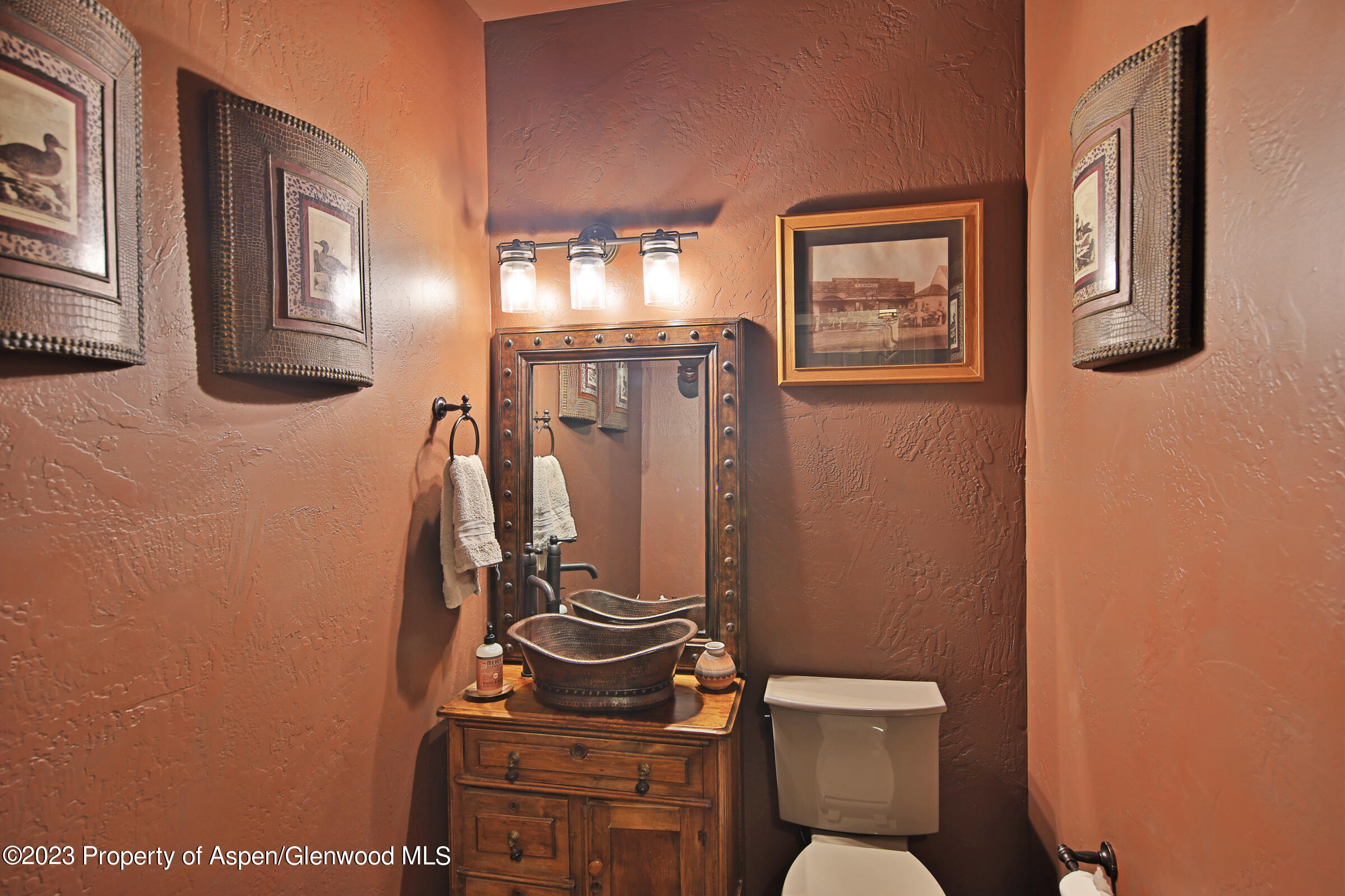 52962 KE Road Molina, CO 81646 - Photo 24 of 46 a bathroom with a toilet a sink and a mirror