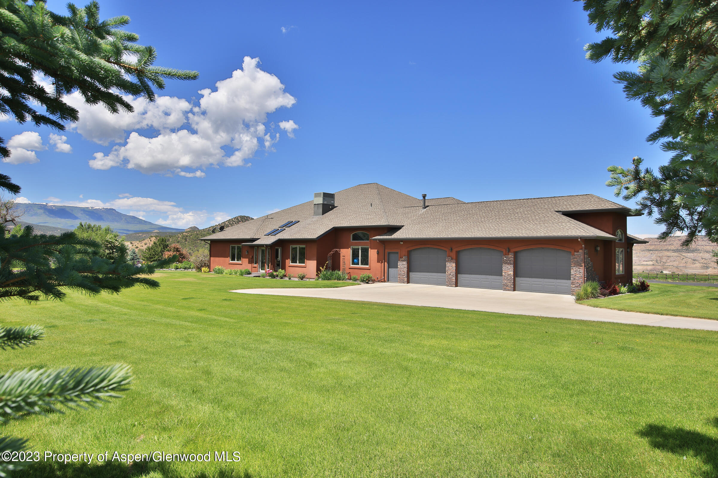 52962 KE Road Molina, CO 81646 - Photo 3 of 46 a front view of a house with garden