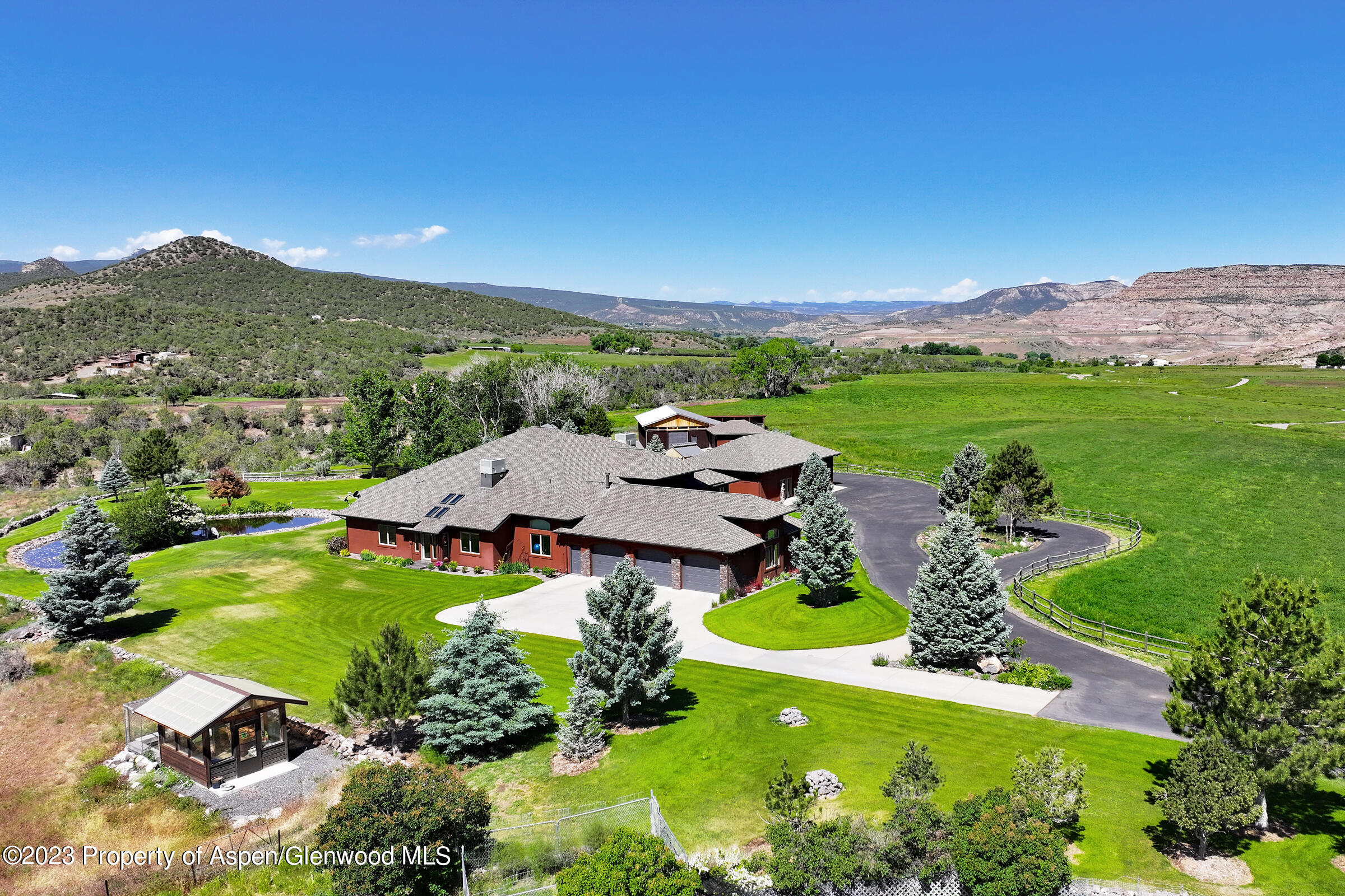 52962 KE Road Molina, CO 81646 - Photo 31 of 46 an aerial view of a house with garden