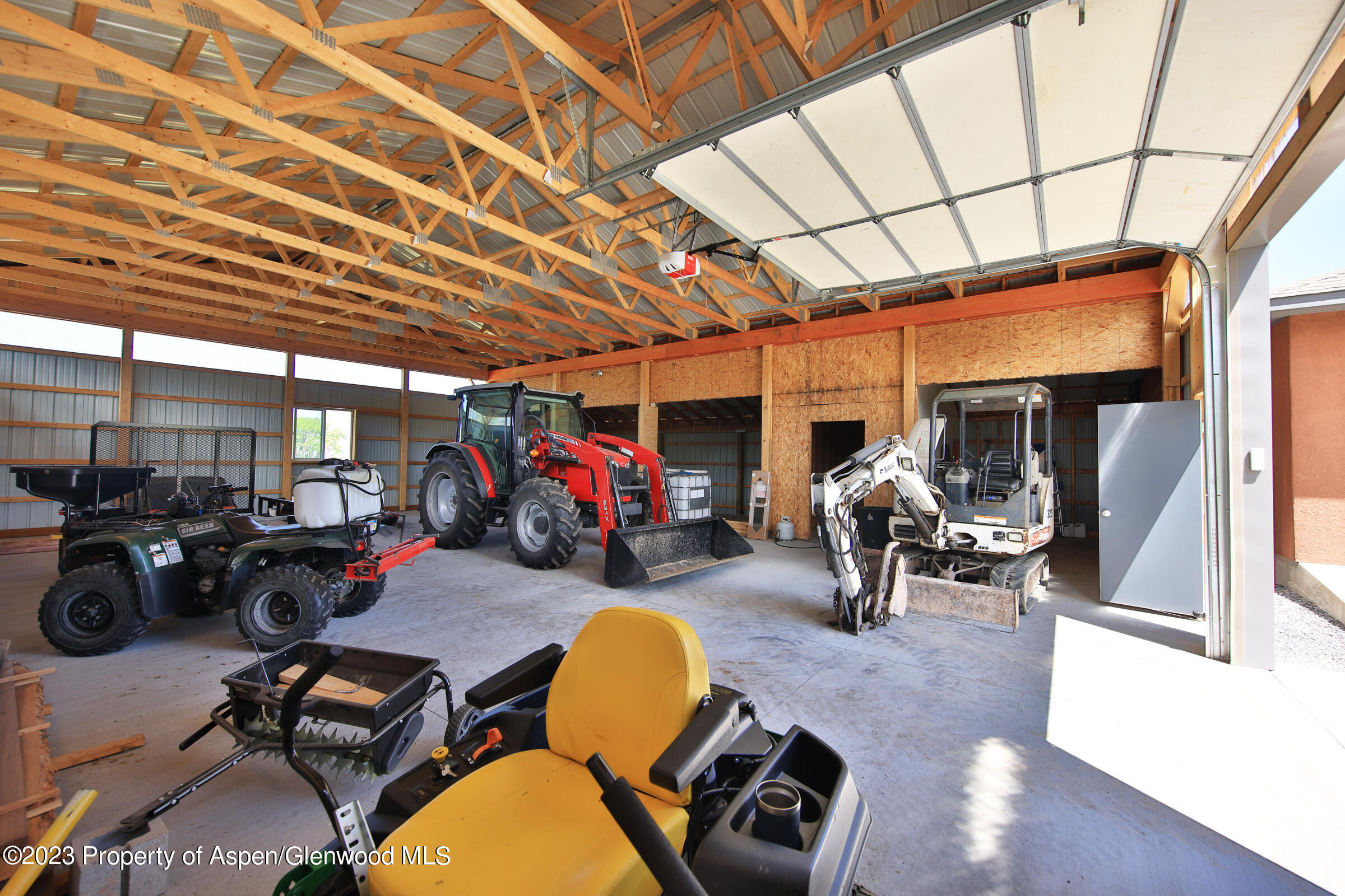 52962 KE Road Molina, CO 81646 - Photo 38 of 46 a view of a garage with a table and chairs