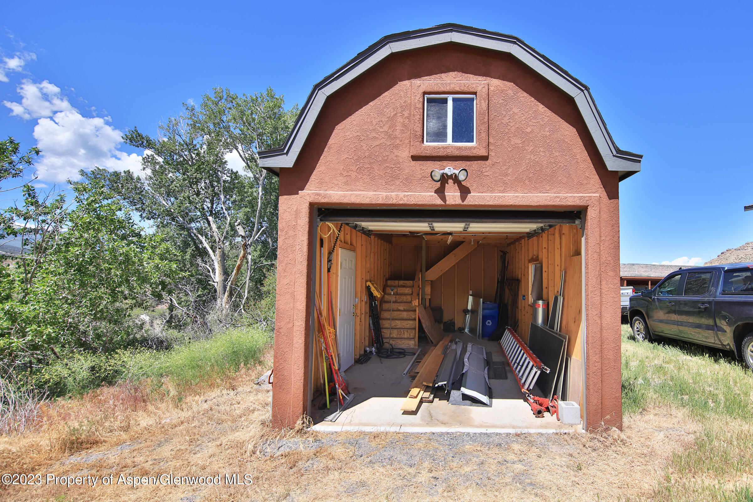 52962 KE Road Molina, CO 81646 - Photo 40 of 46 a view of a house with a yard