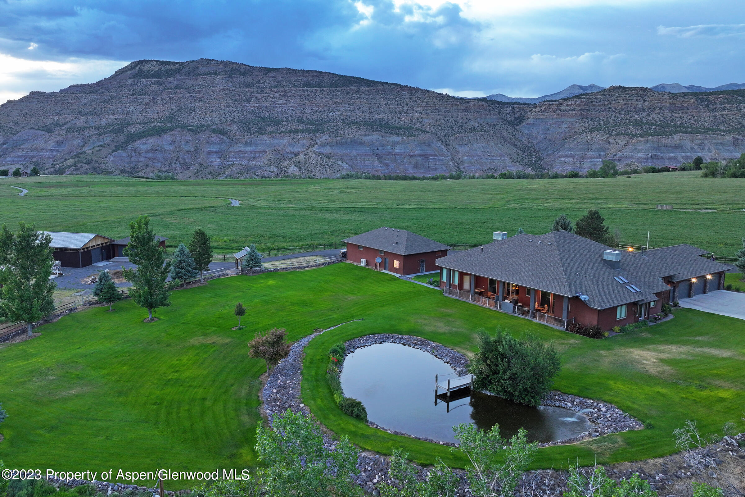 52962 KE Road Molina, CO 81646 - Photo 4 of 46 an aerial view of a house with garden space and outdoor seating