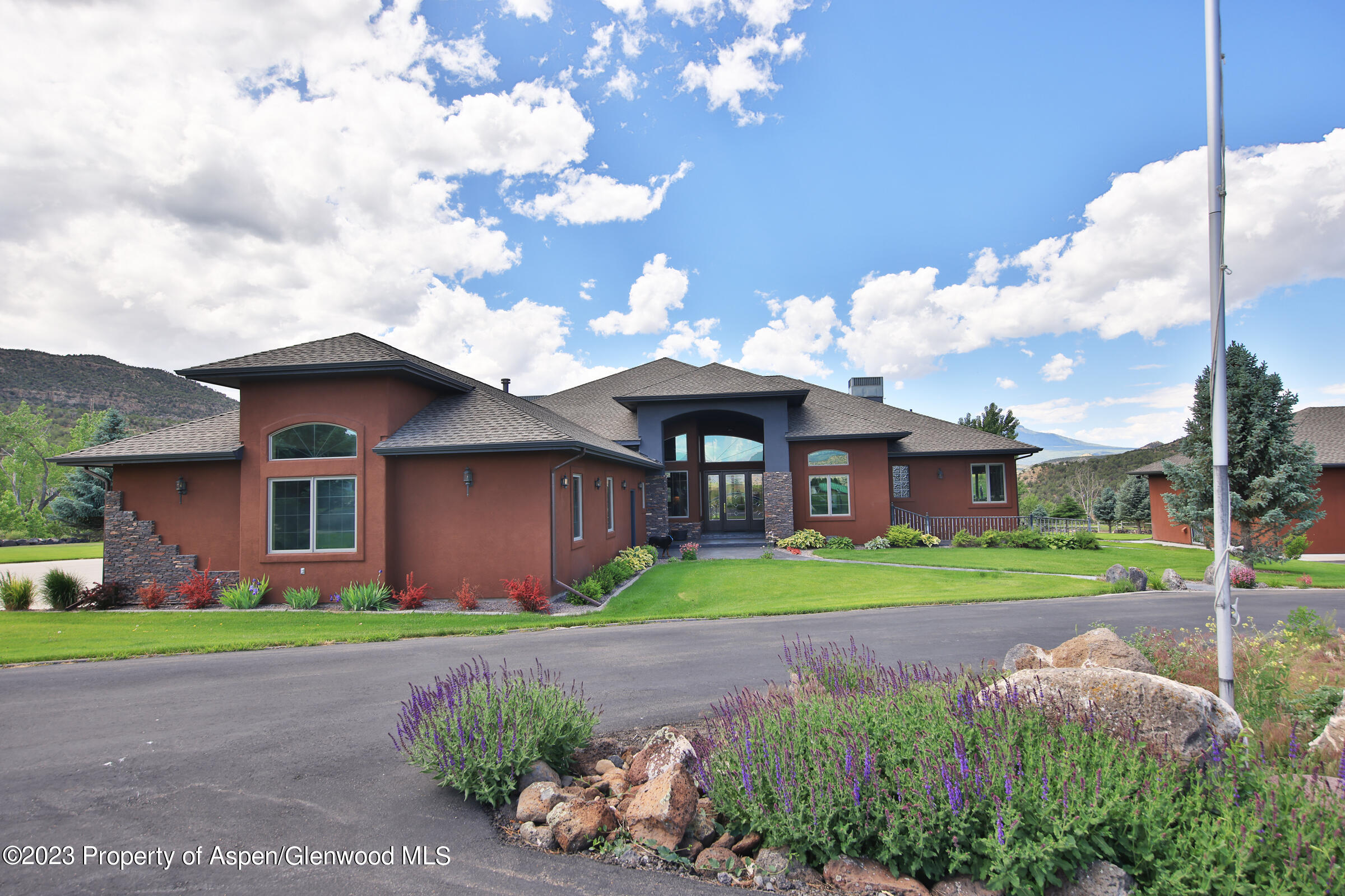 52962 KE Road Molina, CO 81646 - Photo 45 of 46 a front view of a house with garden