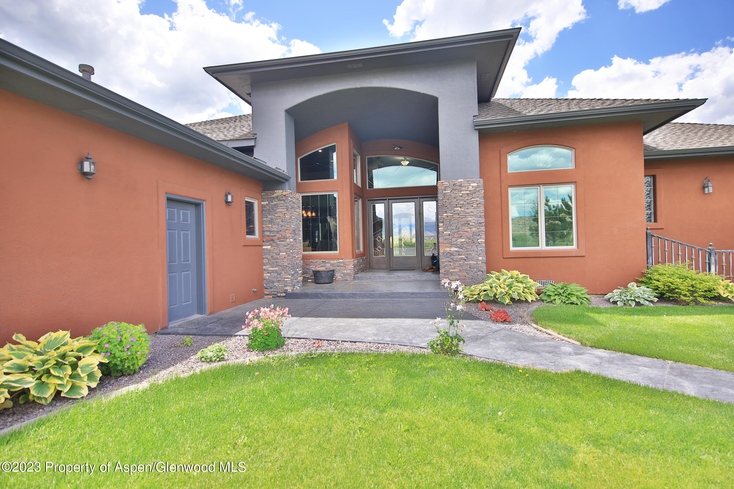 52962 KE Road Molina, CO 81646 - Photo 5 of 46 a front view of a house with garden