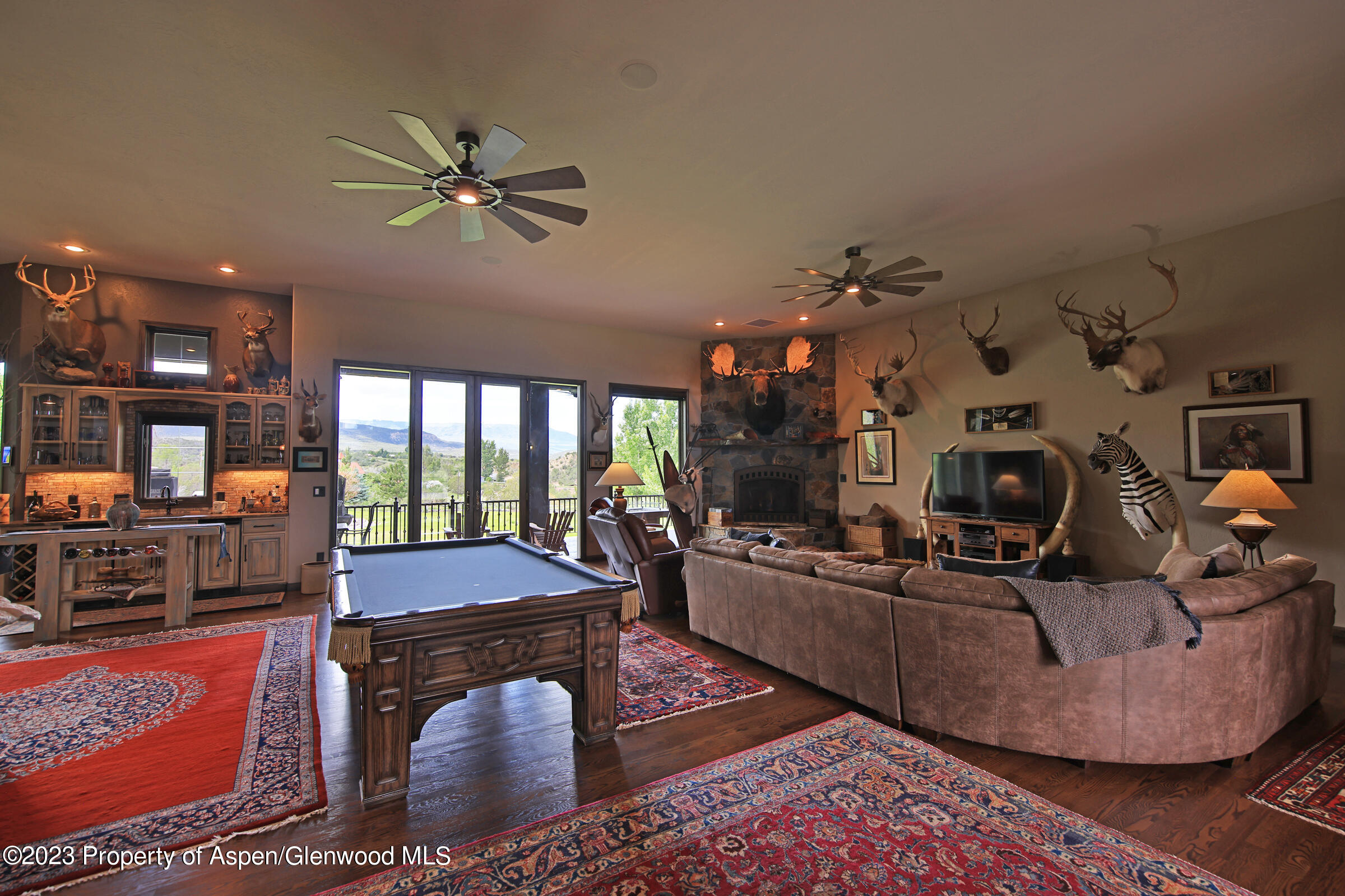 52962 KE Road Molina, CO 81646 - Photo 7 of 46 a living room with fireplace furniture and a flat screen tv