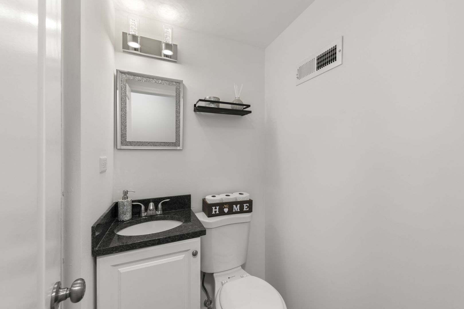 530 East Briarcliff Road Bolingbrook, IL 60440 - Photo 16 of 19 a bathroom with a granite countertop toilet sink and mirror