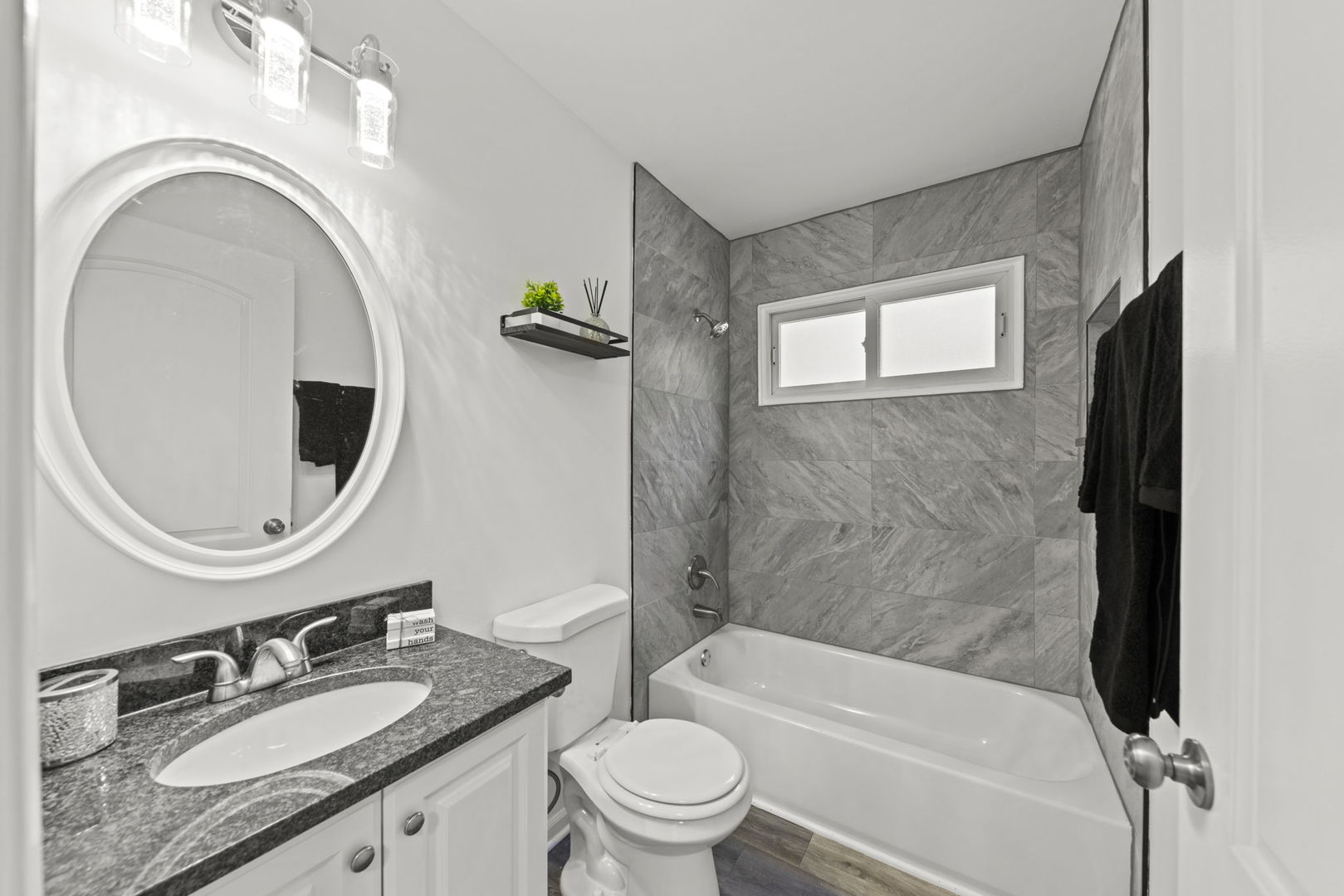530 East Briarcliff Road Bolingbrook, IL 60440 - Photo 10 of 19 a bathroom with a granite countertop toilet a sink and a bathtub