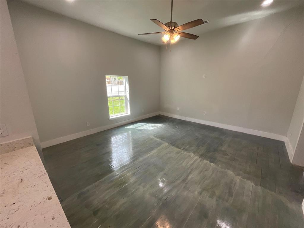 207 College Street Chico, TX 76431 - Photo 14 of 20 Unfurnished room featuring dark wood-style flooring, recessed lighting, and ceiling fan